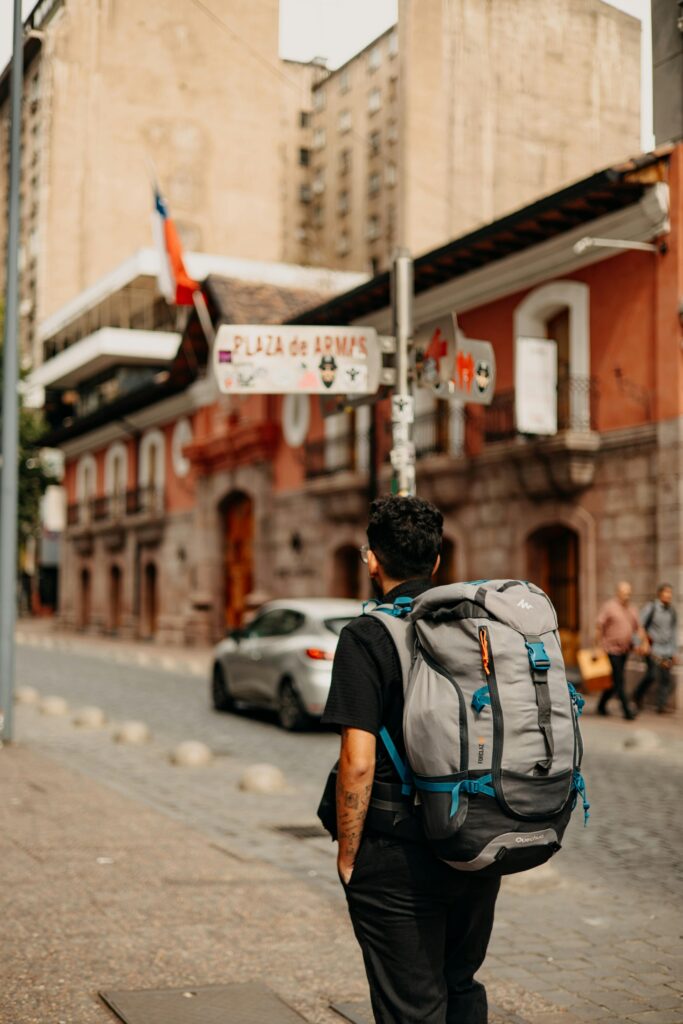 A backpacker exploring the streets near Plaza de Armas, Santiago, Chile.